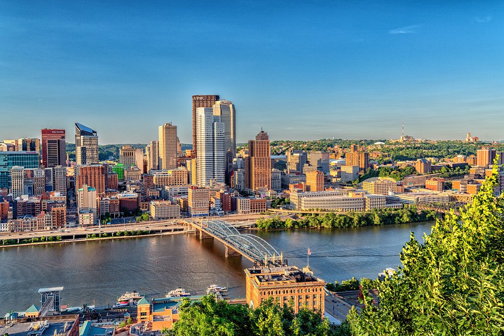 Pittsburgh skyline at golden hour, representing in-home newborn circumcision in Pittsburgh