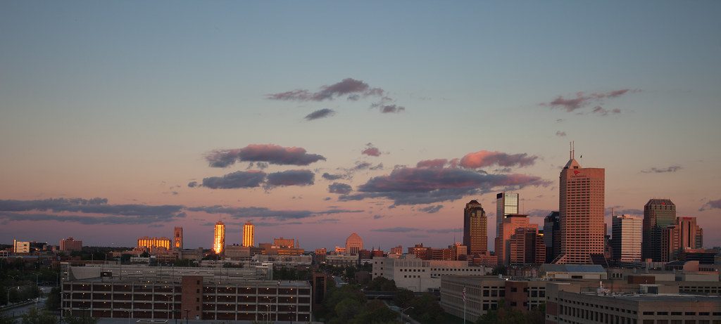 Indianapolis skyline at golden hour, representing in-home newborn circumcision in Indianapolis