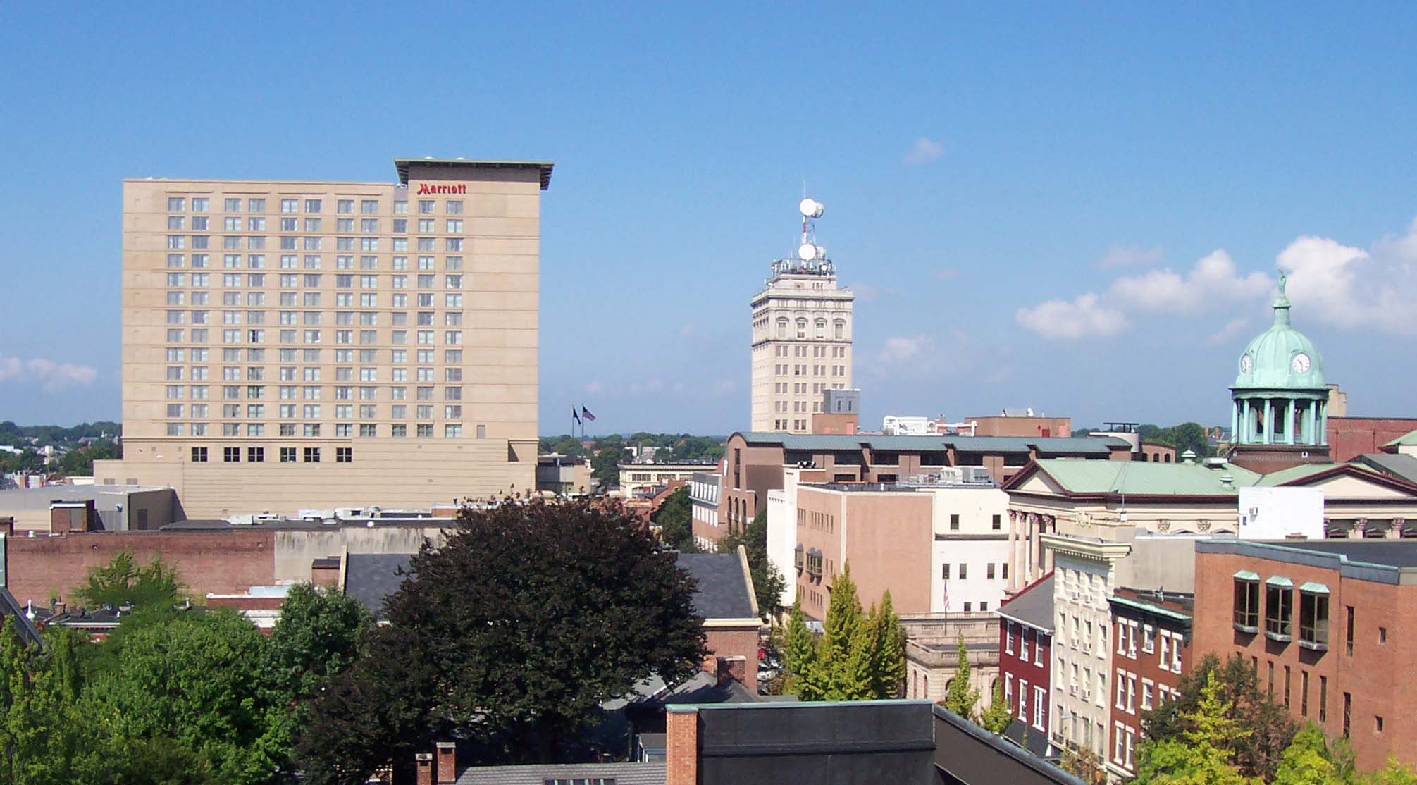 Downtown Lancaster, Pennsylvania skyline with the Griest Building and Lancaster County Courthouse dome, representing in-home newborn circumcision in Lancaster
